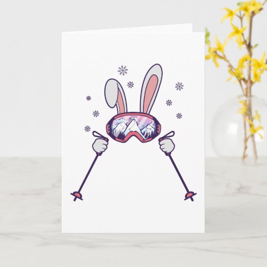 スキーポールとスキーゴーグルを持つスキーウサギ カード (黄色い花)