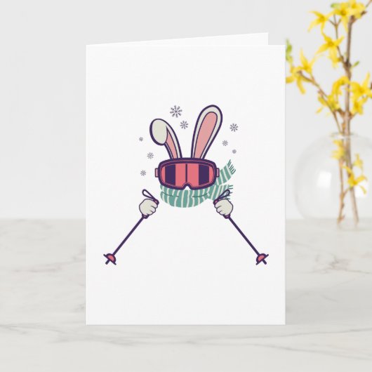 スキーポールとスキーゴーグルを持つスキーウサギ カード (黄色い花)
