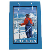 スキーヤーの敬服の念に満ちたヴィンテージ旅行ポスター ミディアムペーパーバッグ (正面)