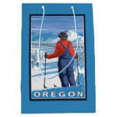 スキーヤーの敬服の念に満ちたヴィンテージ旅行ポスター ミディアムペーパーバッグ (正面)