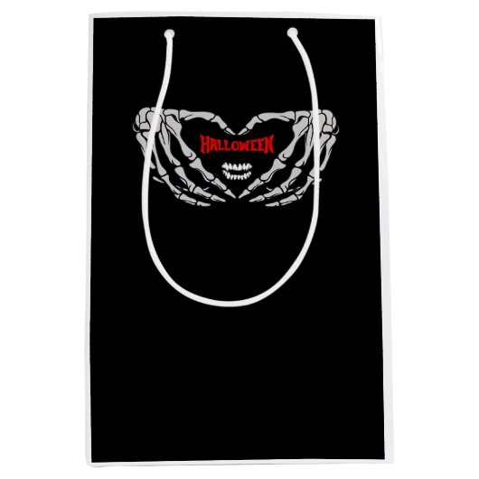 スケルトンの手をハートで折り畳む。おかしなハロウィーン ミディアムペーパーバッグ (正面)