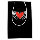 スケルトンハンド形成ハート – 不気味なゴシック様式のハロ ミディアムペーパーバッグ (正面)