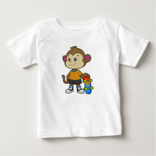スケートボードを使ったスケーターとしてのサル ベビーTシャツ