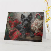 スコティッシュテリア犬のクリスマス カード (黄色い花)