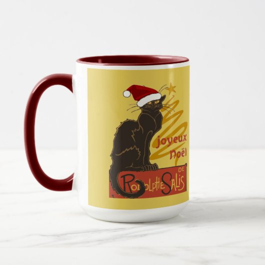 スタイリッシュな金の木が描かれた「Joyeux Noel Le Chat Noir」 マグカップ (左)