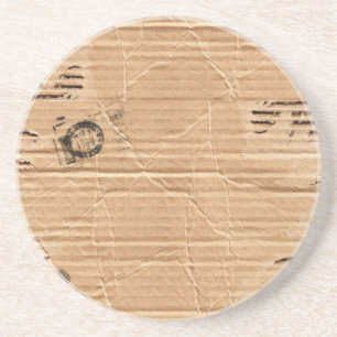 スタンプおよび汚れが付いているブラウンの古い傷つけられたボール紙 コースター