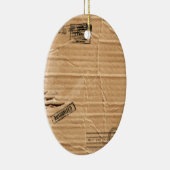 スタンプおよび汚れが付いているブラウンの古い傷つけられたボール紙 セラミックオーナメント (右)