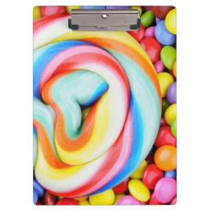 ストライプのな棒つきキャンデーおよび多彩のSmarties クリップボード