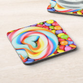 ストライプのな棒つきキャンデーおよび多彩のSmarties コースター (左側)