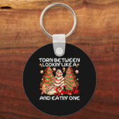 スナックケーキパのように見ている間で引き裂かれたクリスマスツリー キーホルダー (正面)