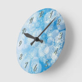 スノーフレークの背景 ラウンド壁時計 (傾斜)