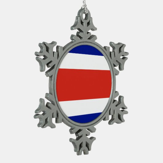 スノーフレークオーナメントとコスタリカ国旗 スノーフレークピューターオーナメント (左)