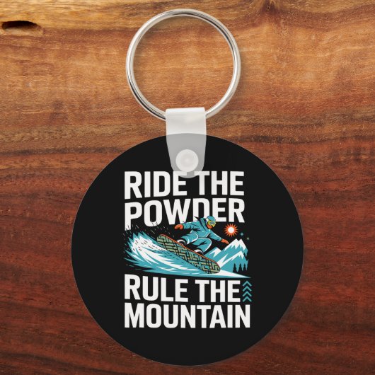 スノーボーダーはパウダーに乗って山の雪を支配 キーホルダー (正面)