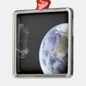 スピッツァーは打ち上げ直後に地球を出発 メタルオーナメント (左)