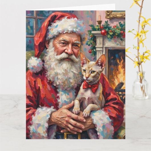 スフィンクス猫を抱くサンタのクリスマスアート カード (黄色い花)