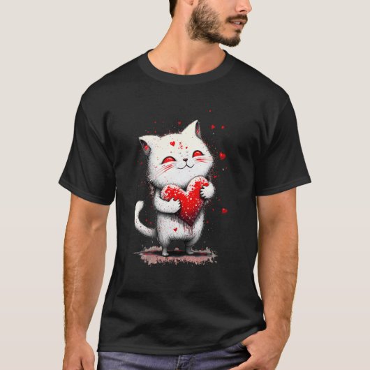 スプラッタペイントの猫がハートの枕を抱っこ - Tシャツ (正面)