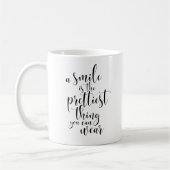スマイルかわいらしは衣服 コーヒーマグカップ (左)