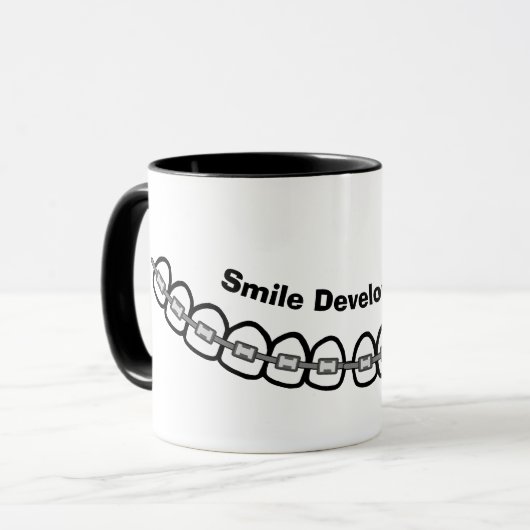 スマイル開発ブレースマグカップ マグカップ (正面左)