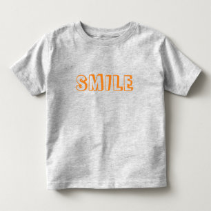 「スマイル」オレンジ色の文字グレー トドラーTシャツ