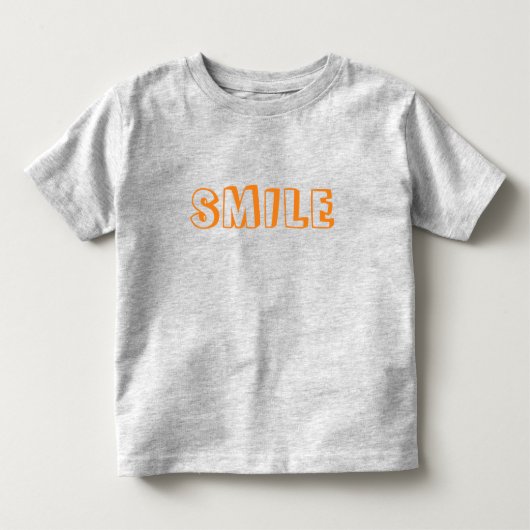「スマイル」オレンジ色の文字グレー トドラーTシャツ (正面)
