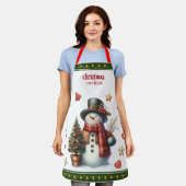 スモールサイズのエプロン: 雪だるまとクリスマスクッキー グリーン エプロン (着用した状態)