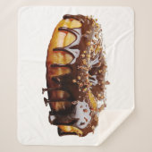 スリップリージョーの贅沢なドーナツは、濃厚で光沢のあるチョコレートのグレーズで覆われている  シェルパブランケット (正面)