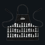 スーシェフチェス駒白黒キッズ エプロン<br><div class="desc">チェックラシックス愛好家のための黒と白のチェスの子供のエプロン，幾何学的なパターンでチェスの姿をフィーチャー。チェスモダン駒デザイン</div>