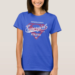 スーパーガールメトロポリススポーツ陸上競技グラフィック Tシャツ