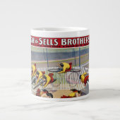 セブン・ゲイネルズのサーカスのポスター自転車に乗る ジャンボコーヒーマグカップ (正面)