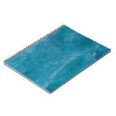 セメントとコンクリートの壁ユニークは模様がある。 ノートブック (左側)