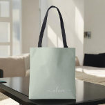 セージグリーンミニマルモダンリストモノグラエレガントム トートバッグ<br><div class="desc">Sage Green Minimalist Monogramコレクションモダンの紹介エレガント：穏やかな洗練と時代を超越したエレガンスで、あなたの美意識を高める。私たちのコレクションは、あなたの個人スタイルに合わせた洗練されたモノグラムによって補完された穏やかな緑の色合いのミニマルなデザインを紹介する。洗練された文房具から多彩なアクセサリーまで、コレクション内の各作品は、どんな場面でも表現できるように細心の注意を払って作られている。あなたは名刺、レターヘッド、あるいは味わい深いホームデザインを求める場合でも、私たちのミニマルなデザインはプロ意識と洗練を醸し出すクリーンで美コンテンポラリーしい外観を提供している。Sage Green Minimalist モダン Monogram Collectionは、その落ち着いたカラーパレットとミニマルな魅力を備えエレガント、シンプルさの美しいを味わう人に最適なコレクションである。エレガンスで自分のパーソナライズされたマークを作り、洗練の本質を受け入れモダンなさい。ビジネス用でも個人用でも、トレンドを超えスタイリッシュて、その控えめな魅力に魅了されるソリューションを提供。</div>