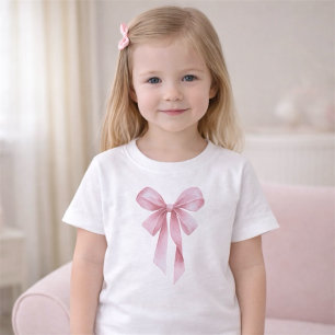 ソフトピンクのリボンガールベビーシャワーパーティー ベビーTシャツ
