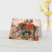 ゾウとサーカスの演技をする男性。 カード (黄色い花)