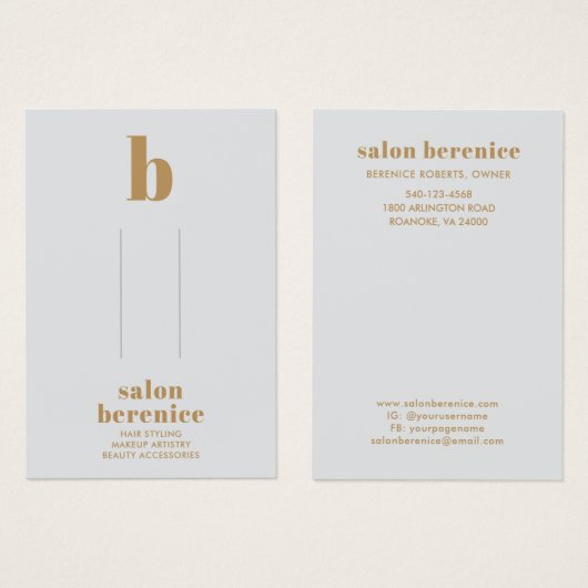 タイポグラフィはっきりした金ゴールドモノグラムヘアクリップの表示 (正面&裏面)