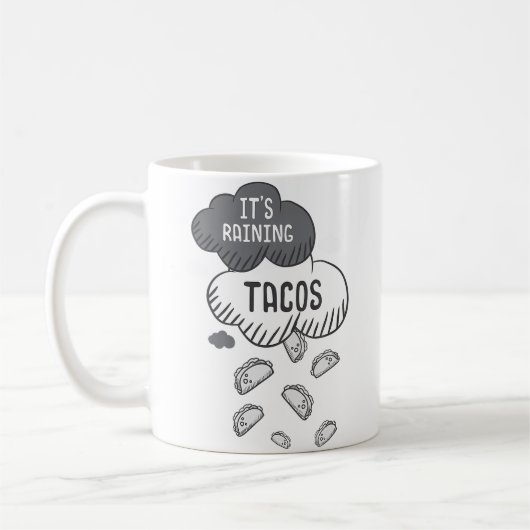 タコスが降る面白Tシャツ コーヒーマグカップ (左)