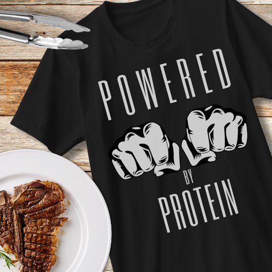 タンパク質の肉食動物の拳で動く Tシャツ