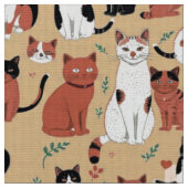 タン背景の遊び心のある猫 ファブリック (クローズアップ)