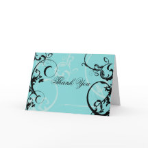 ターコイズにブラックスワールが渦巻く装飾が施されている