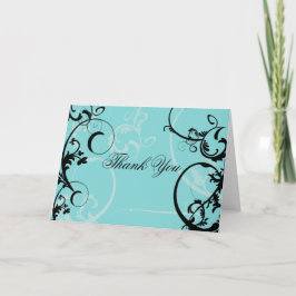 ターコイズにブラックスワールが渦巻く装飾が施されている サンキューカード
