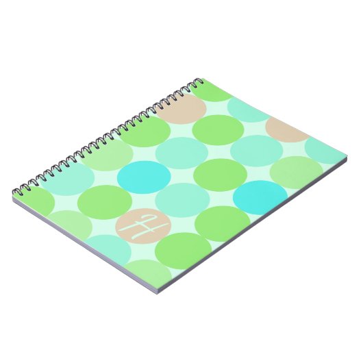 ターコイズブルー&オレンジサークルモノグラム ノートブック (左側)