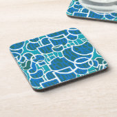 ターコイズ、緑、青いコルクで覆われたコースター コースター (左側)