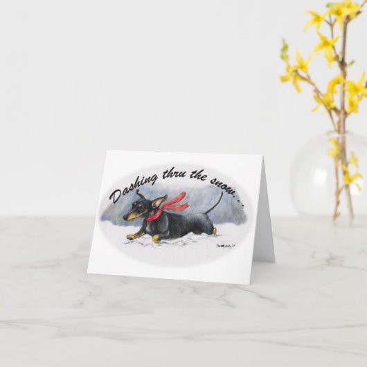 ダックスフンドが雪を駆けるクリスマス・ノートカード カード (黄色い花)