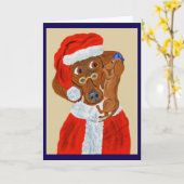 ダックスフンドの子犬がサンタにクリスマスの願い事を伝える カード (黄色い花)