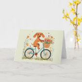 ダックスフンドの犬の自転車と春の花の誕生日おめでとう カード (黄色い花)