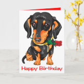 ダッチシュント子犬の漫画かわいい犬の誕生日 カード (黄色い花)