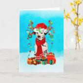 ダルメシアンが雪の中でクリスマスの贈り物を持って カード (黄色い花)