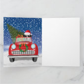 ダルメシアンの犬が雪の中で赤い車を運転するクリスマス カード (内部)