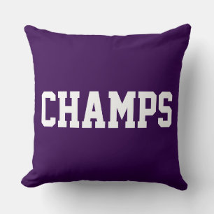 ダークパープルの背景に白文字のAthletic Sporty CHAMPS クッション