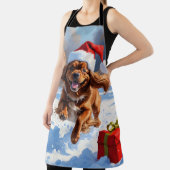 チベットのスパニエル犬走のクリスマス帽子と雪の中 エプロン (インサイチュ)