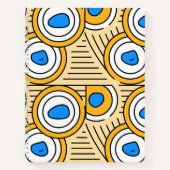 チベットの抽象的なパターンが施された土っぽい背景の青 ノートブック (正面)